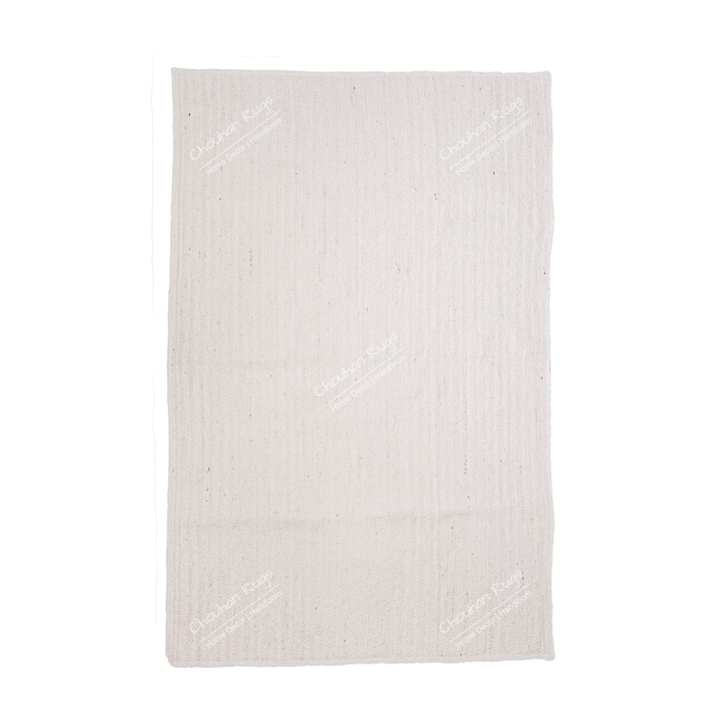 "A minimalist and highly textured hand-braided jute rug, presented in a clean, natural off-white/ivory tone. The vertical weave pattern creates subtle visual depth, while the overall simple design makes it a versatile foundation piece perfect for adding organic warmth and understated elegance to any modern or coastal living space."