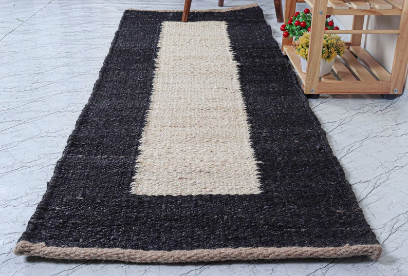 Handwoven natural jute area rug with a off white center stripe, eco-friendly handmade rug designed for modern boho and farmhouse interiors. This rustic natural fiber floor rug adds warmth and texture to living rooms, bedrooms, hallways, or entryways. Durable artisan-crafted jute carpet with neutral tones that complement minimalist, Scandinavian, and contemporary home décor while bringing an organic, earthy look to any space. 🏡