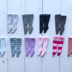 May include: A set of 10 pairs of striped knee-high socks in various colours, including grey, black, white, blue, purple, pink, and red.