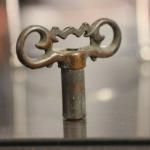 Antique Brass Clock Key: Ornate Handle, Hexagon Hole