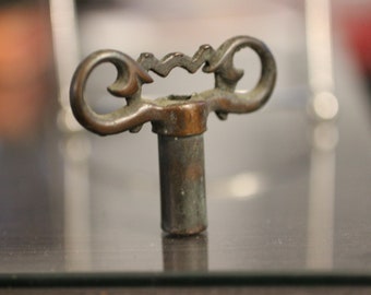 Antique Brass Clock Key: Ornate Handle, Hexagon Hole
