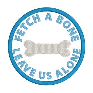 May include: Embroidered patch with a light blue border and text that reads "FETCH A BONE LEAVE US ALONE" in light blue. A bone graphic is in the center of the patch.
