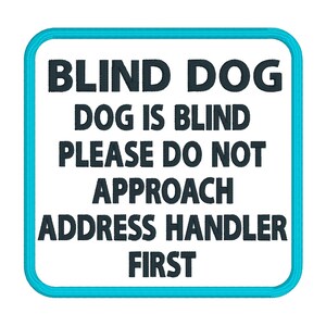 May include: A white square sign with a blue border, reading "BLIND DOG DOG IS BLIND PLEASE DO NOT APPROACH ADDRESS HANDLER FIRST".