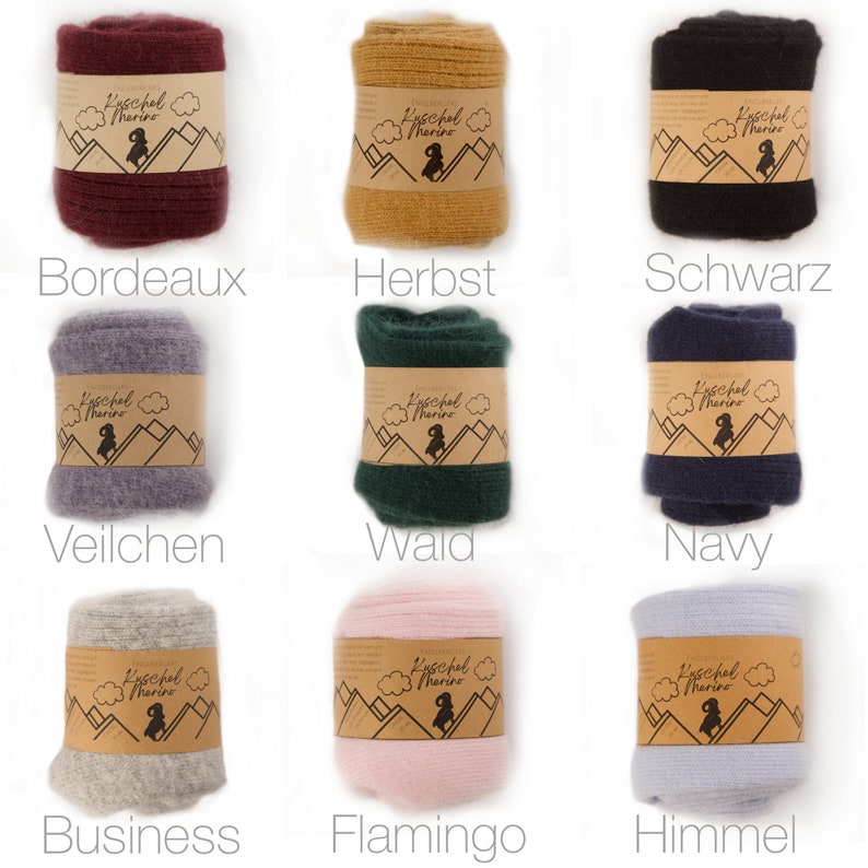 May include: Nine different colours of wool leg warmers with a brown label that says "Kuschel Merino". The colours are Bordeaux, Herbst, Schwarz, Veilchen, Wald, Navy, Business, Flamingo, and Himmel.