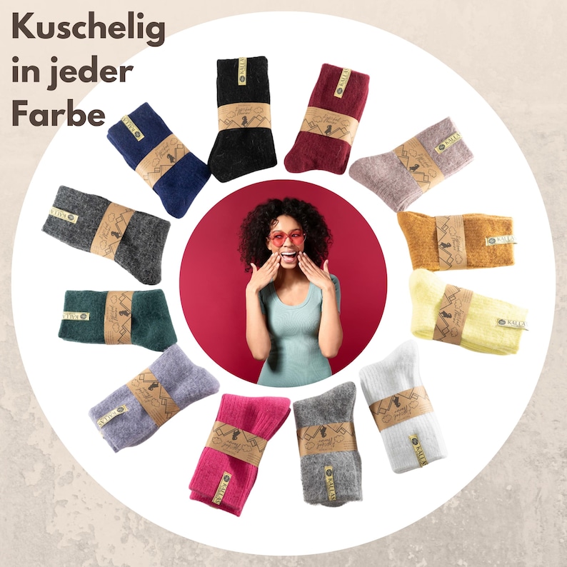 May include: A selection of colourful socks arranged in a circle around a woman wearing sunglasses. The socks are all made from a soft, cosy material and come in a range of colours, including grey, black, red, pink, yellow, and blue. The text "Kuschelig in jeder Farbe" is written at the top of the image.