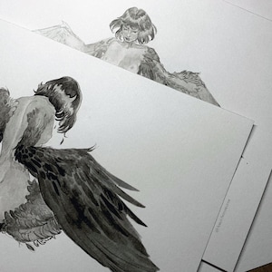 Original artwork of a Harpy mythical creature drawn in pencil and ink sitting on a bed that acts as a white background showing sizing of the original artwork.