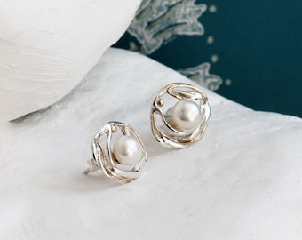 Undulating Silver Freshwater Pearl Studs with Gold detailing.