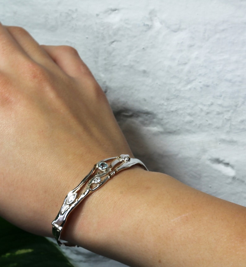 Hinged Silver Bangle with Blue Topaz and White Cubic Zirconia