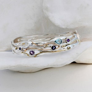 Beautiful bangle decorated with Gold, Blue Topaz, Iolite and Amethyst