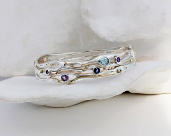 Beautiful bangle decorated with Gold, Blue Topaz, Iolite and Amethyst