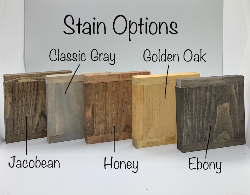 May include: Five wood samples stained in different colors: Classic Gray, Golden Oak, Jacobean, Honey, and Ebony. The samples are arranged in a row from left to right.