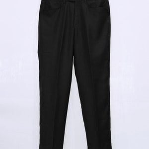 May include: Black dress pants with a straight leg and a classic fit.