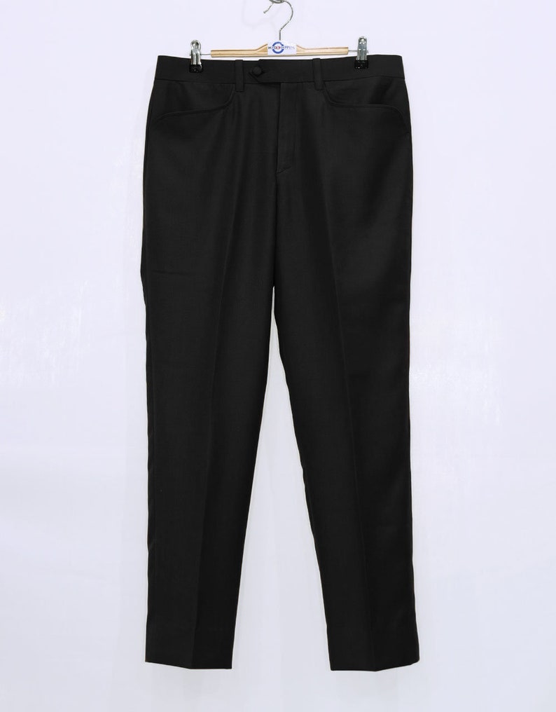 May include: Black dress pants with a straight leg and a classic fit.