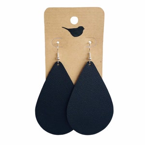 May include: A pair of black leather teardrop earrings with silver hooks.