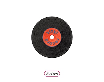 May include: Black vinyl record with an orange label that says "Vinyl Record" in blue lettering.