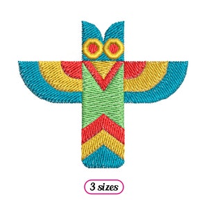 May include: A colorful geometric owl design with blue, green, yellow, and red colors. The design is in the shape of a cross with the owl's head at the top. The text "3 sizes" is below the design.