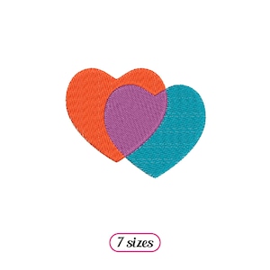 Peut inclure: Deux cœurs se chevauchant, l'un orange et l'autre turquoise avec un cœur violet à l'intérieur. Les cœurs sont cousus ensemble.
