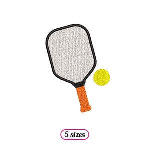 May include: A black and orange pickleball paddle with a white surface and a yellow pickleball.
