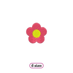 May include: A pink flower with a yellow center. The flower is a simple design with five petals.