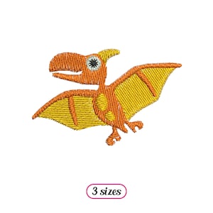 May include: Orange and yellow embroidered design of a cartoon pterodactyl with a black eye. The design is available in three sizes.