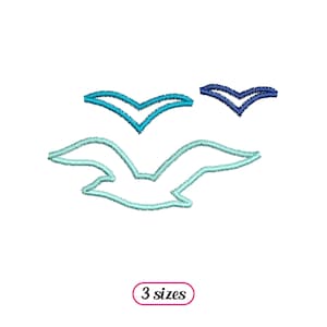 May include: An embroidery design featuring three seagulls in flight. The seagulls are outlined in blue and turquoise shades. The design is available in three sizes.
