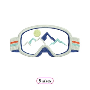Peut inclure: Lunettes de ski blanches avec un cadre bleu et une scène de montagne à l'intérieur de la lentille. La scène de montagne comprend un soleil jaune et des montagnes bleues et vertes.