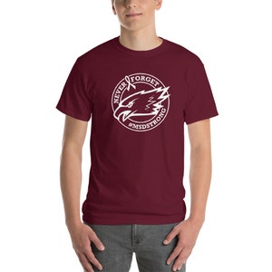 May include: A maroon t-shirt with a white graphic of an eagle head with a ribbon and the text "NEVER FORGET #MSDSTONG".