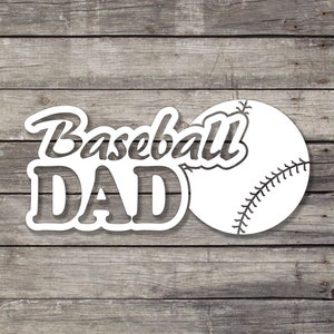 May include: White vinyl decal with the text "Baseball Dad" and a baseball graphic.
