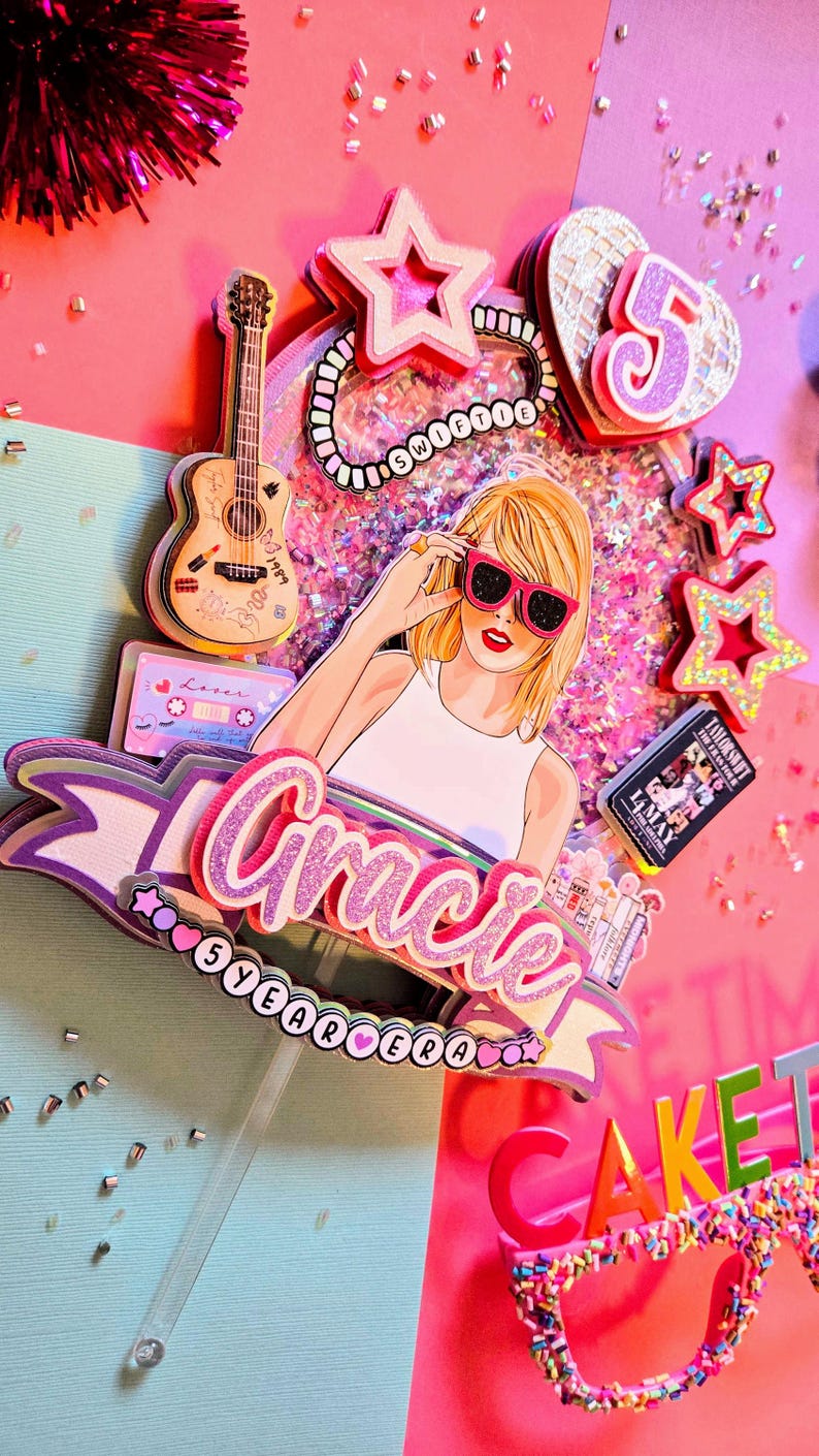 May include: A vibrant cake topper featuring a cartoon illustration of a woman wearing pink sunglasses. The topper includes a guitar, cassette tape, stars, and the name "Gracie" with "5 Year Era" text. The color scheme is predominantly pink and purple.
