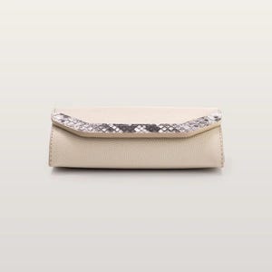 May include: A rectangular clutch bag in a light beige textured material. The front flap features a decorative band with a grey and white snakeskin pattern. The bag has a structured, elongated shape with visible stitching along the side edges.