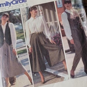 May include: A vintage sewing pattern for a skirt and trousers, labelled "Butterick 5057". The pattern includes three different styles: a wide-leg skirt, a narrower skirt, and a pair of trousers. The pattern is printed on brown paper with black lines.