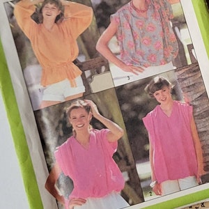 May include: Simplicity sewing pattern number 8574 for a Jiffy top. The pattern includes instructions and diagrams for making a blouse with a gathered neckline and a tie belt. The pattern is shown on a model wearing a white blouse with a floral print.