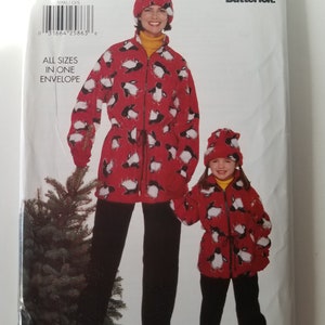 May include: A sewing pattern for a red and white penguin print fleece jacket and matching hat for both a mother and daughter. The pattern is from Butterick and is for all sizes.
