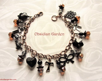 EVANORA...hand made unique antique copper plated bracelet with black charms.