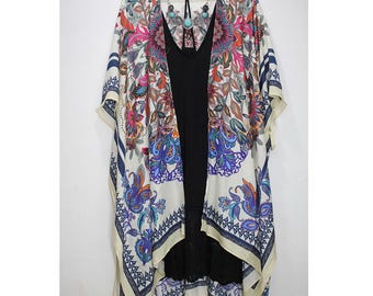 May include: A white floral print kimono with blue and pink accents. The kimono has a geometric border and a loose, flowing silhouette.