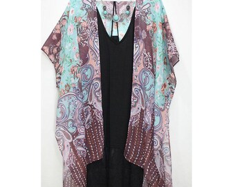 May include: A sheer, floral patterned kimono with a paisley design in shades of pink, blue, and brown. The kimono has a V-neck and short sleeves.