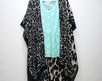 May include: A black and white leopard print kimono with a light blue lace top underneath. The kimono has a long, flowing design and is perfect for layering.