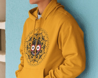 May include: A mustard yellow hoodie with a black and white mandala design featuring a red and black deity face in the centre.