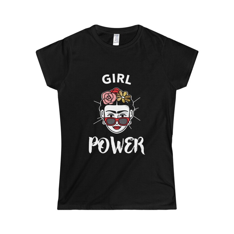 May include: Black t-shirt with a white graphic of a woman with flowers in her hair and sunglasses. The text "GIRL POWER" is below the image.