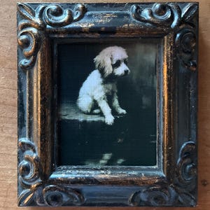 HAND PAINTED MINIATURE on a 2.5”x3”  on a linen paper print ,bonded to canvas of little dog .framed