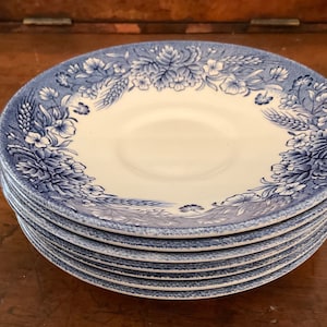 7  vintage CERAMIC SAUCERS, made in England