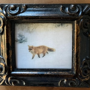 HAND PAINTED MINIATURE of a fox in the snow on a 2.5x3” canvas print ,placed in an antiqued resin frame.