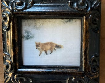 HAND PAINTED MINIATURE of a fox in the snow on a 2.5x3” canvas print ,placed in an antiqued resin frame.