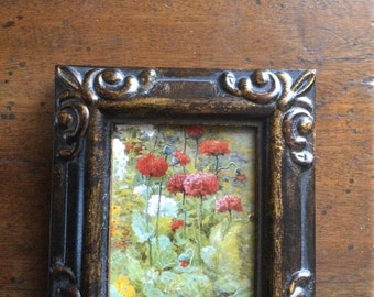 HAND PAINTED MINIATURE on  a canvas print of flowers in field.