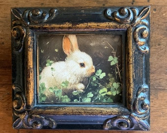HAND PAINTED MINIATURE  on a 2.5”x3” canvas print ,bonded to canvas of a baby bunny/ .framed