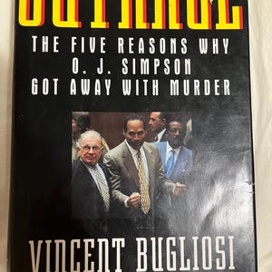 May include: A book titled "OUTRAGE" with the subtitle "THE FIVE REASONS WHY O. J. SIMPSON GOT AWAY WITH MURDER." The cover features a photo of O.J. Simpson and other men in suits. The author's name, Vincent Bugliosi, is also displayed.