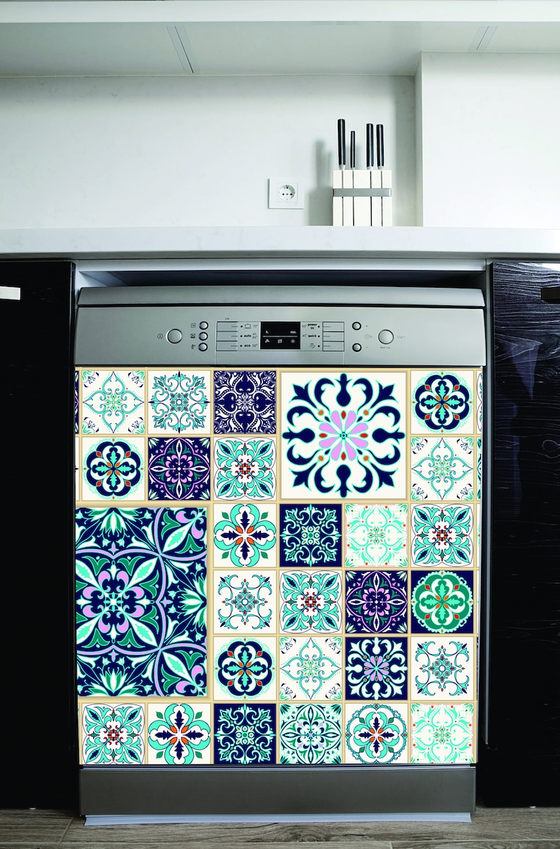 May include: A stainless steel dishwasher with a decorative tile design in shades of blue, green, and white. The tiles feature intricate patterns and floral motifs.