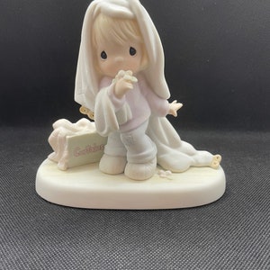 Vintage Precious Moments “June” figurine. 110043