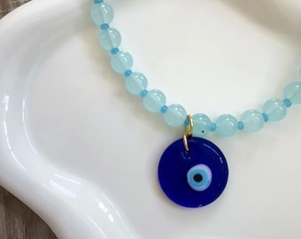 Ocean blue glass beaded necklace with evil eye charm