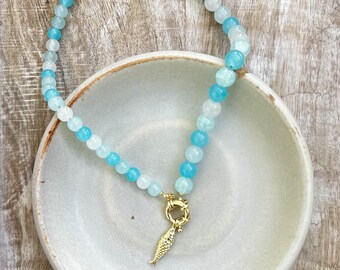 Blue glass beaded necklace with gold filled fish charm and sailor clasp